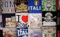 A vibrant assortment of Italian-themed graphic T-shirts showcasing classic designs and iconic landmarks.